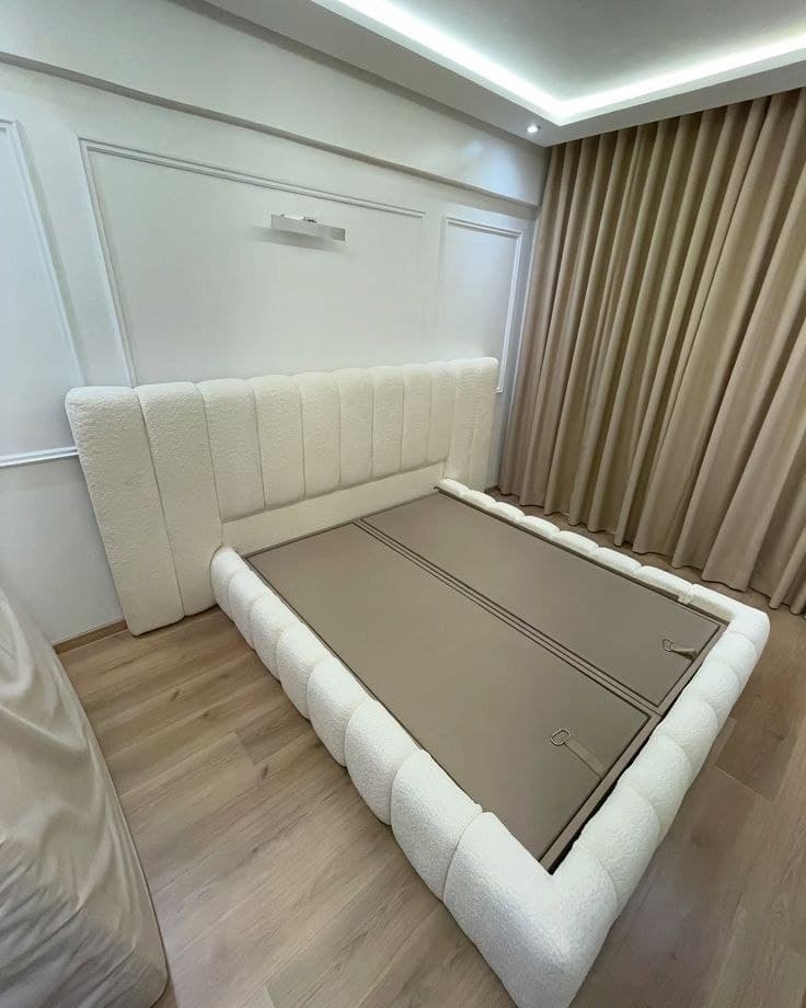 Cream bouclé channel bed with storage base